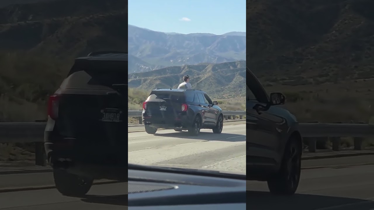 A video of a passenger sticking out of the sunroof in the Cajon Pass
